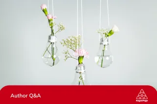 White and pink flowers in lightbulb hanging from the ceiling