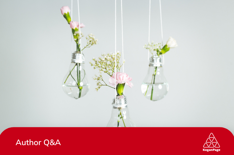 White and pink flowers in lightbulb hanging from the ceiling