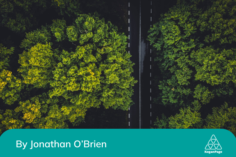 Birds eye view of a road surrounded by trees