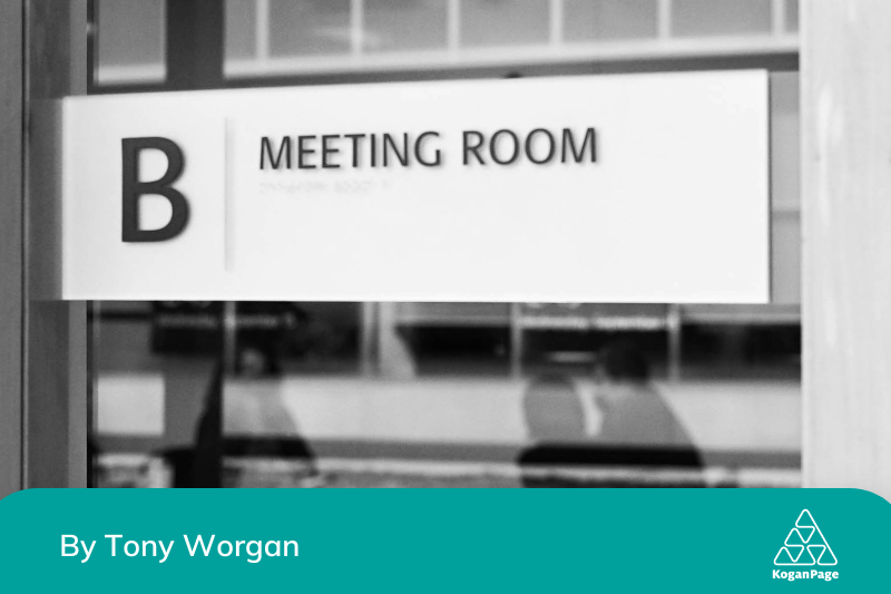 black and white photo of a meeting room 