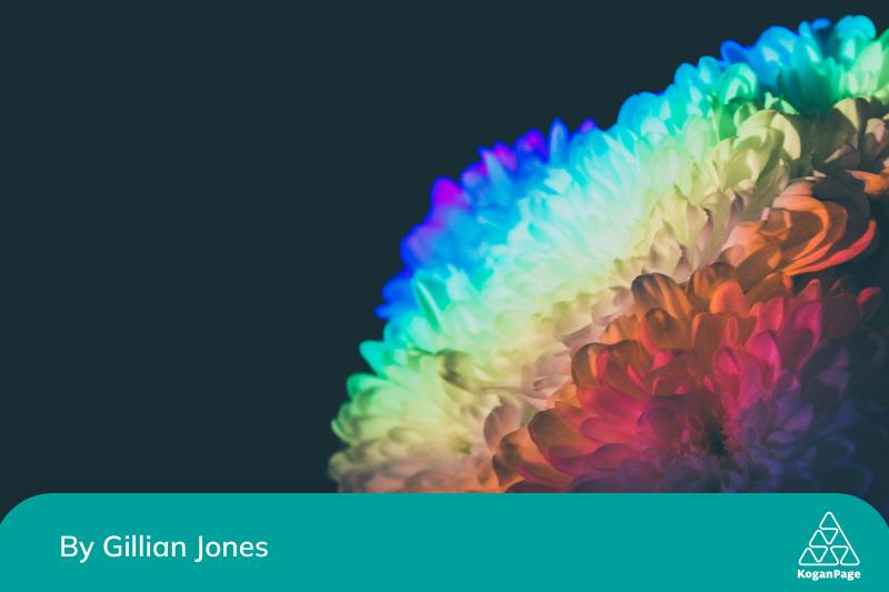 A multicoloured flower on a black background