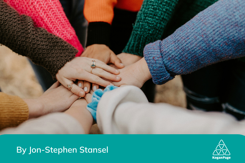 A group of people’s hands piled together