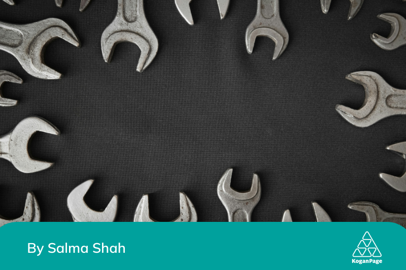 A group of wrenches arranged in a circle on a black background 