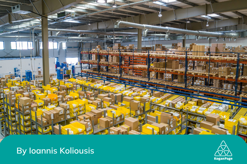 A large warehouse filled with shelves stocked with numerous brown and yellow boxes. The shelves are organized in long rows, extending into the distance.