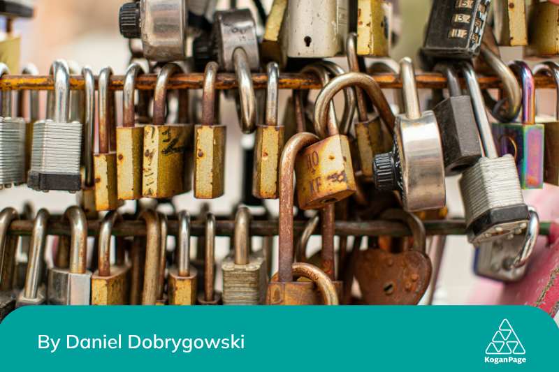 A close-up view of various padlocks on a hanging rod